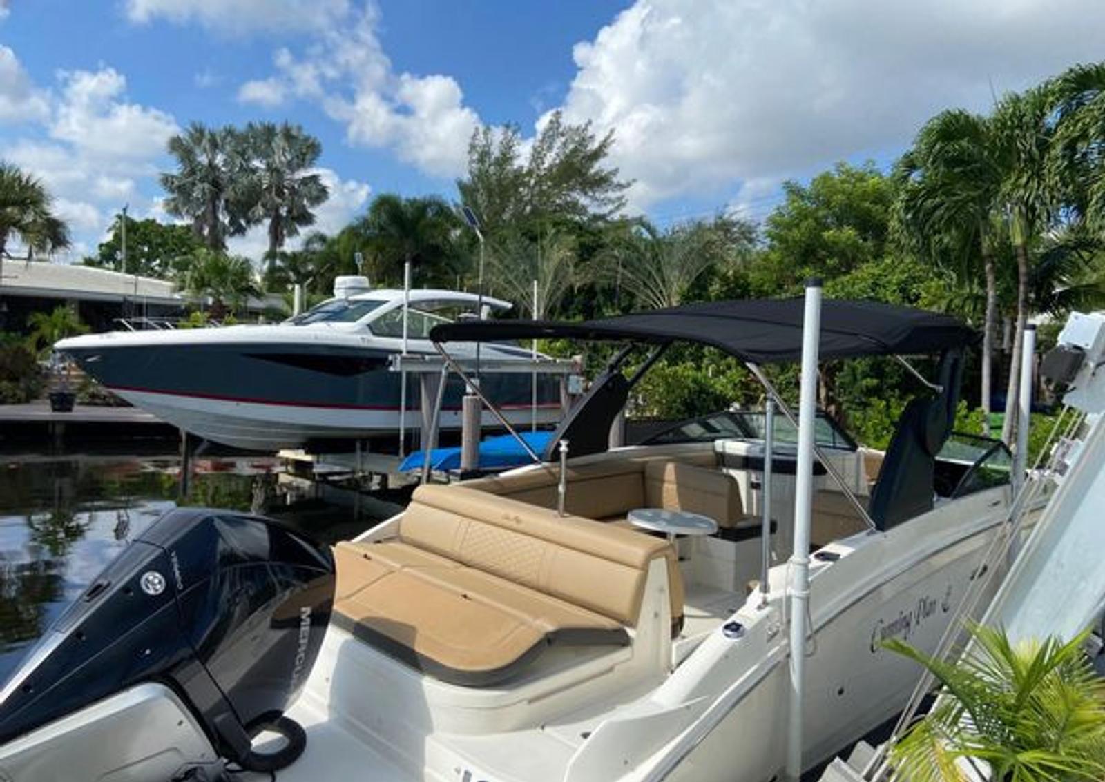 Rear seating and shade canopy aboard the Sea Ray